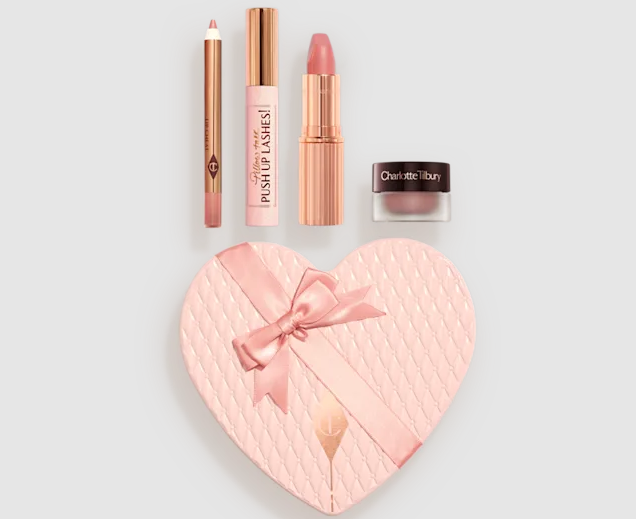Charlotte Tilbury Pillow Talk makeup set with lip liner, lipstick, mascara, and eyeshadow, displayed with a heart-shaped gift box.