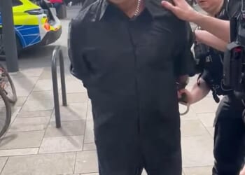 Three Hertfordshire Police officers put Steve Maile in handcuffs in Watford and arrest him