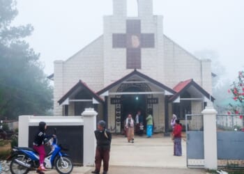 Christian churchgoers leave a church in Loimwe, Shan State, Myanmar on April 2, 2017.