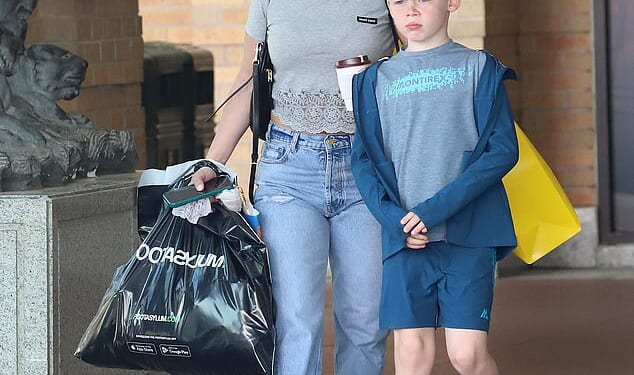 Coleen Rooney enjoyed a lavish shopping trip at Selfridges at Manchester's Trafford Centre with her son Klay on Friday