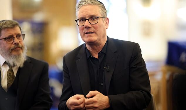 Sir Keir Starmer talks during a visit to Kenton United Synagogue, in northwest London, which was recently the target of an attempted arson