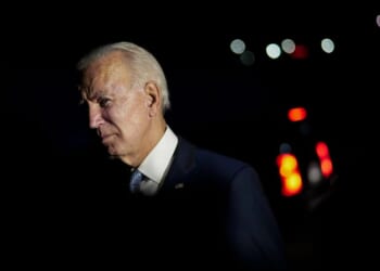 Then-Democratic presidential nominee Joe Biden talks with local firefighters as he leaves a CNN townhall in Moosic, Pennsylvania, on Sept. 17, 2020.