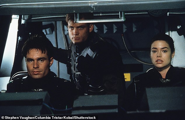 He is also known for his role as Zander Barcalow, left, in the 1997 sci-fi movie Starship Troopers, alongside his ex-girlfriend Denise Richards, right, and Casper Van Dien, center