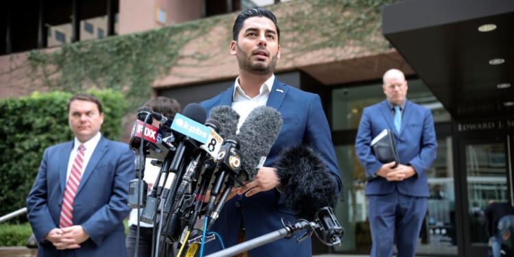 Ammar Campa-Najjar, a Democrat candidate who was running for congress in Rep. Duncan Hunter's district, speaks to reporters outside the Federal Courthouse in San Diego, California, on Dec. 3, 2019.