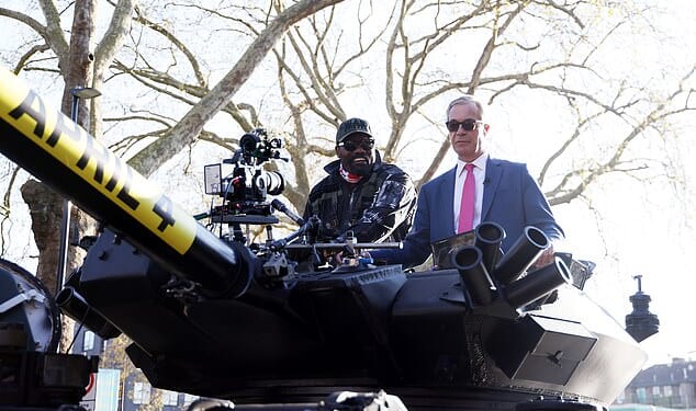 Derek Chisora (left) arrived to his press conference ahead of his fight with Deontay Wilder in a tank with Nigel Farage (right)