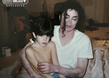 Michael Jackson sits with nine-year-old Dominic Cascio in what the Cascio family believes is a hotel room in 1996. Dominic now says the image reflects the 'fear and confusion' he was experiencing at the time