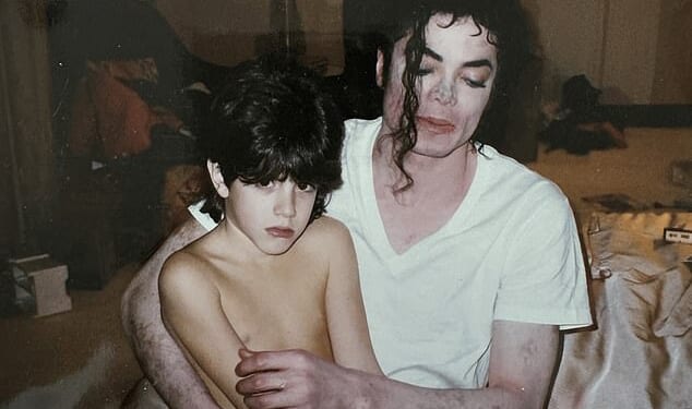 Michael Jackson sits with nine-year-old Dominic Cascio in what the Cascio family believes is a hotel room in 1996. Dominic now says the image reflects the 'fear and confusion' he was experiencing at the time