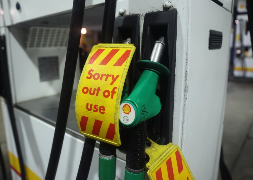 A petrol pump at a Shell station with a yellow and red "Sorry out of use" sign, indicating a fuel shortage.