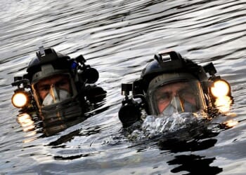 An elite team of Royal Navy divers is on standby to deploy to the Strait of Hormuz to help defuse Iranian mines blocking shipping lanes (file photo)