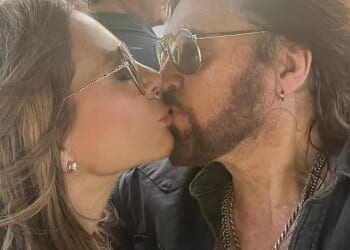 Elizabeth Hurley and Billy Ray Cyrus shared a passionate kiss as the actress supported the singer at country music festival Stagecoach