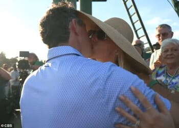 Rory McIlroy kissed and embraced his wife, Erica Stoll, after winning the 2026 Masters