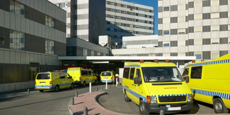 An ambulance in a hospital parking lot in Spain.