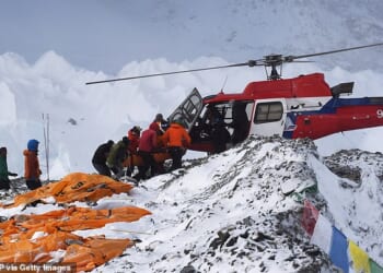 An injured person is loaded onto a rescue helicopter at Everest Base Camp on April 26, 2015