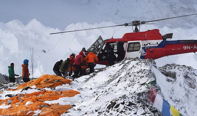 An injured person is loaded onto a rescue helicopter at Everest Base Camp on April 26, 2015