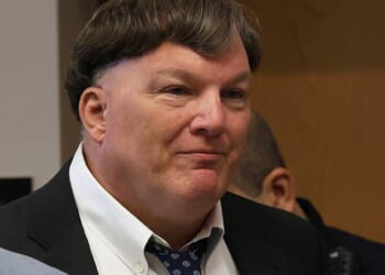 Rex Heuermann appears to smirk as he pleads guilty to murdering seven women and admits to killing an eighth