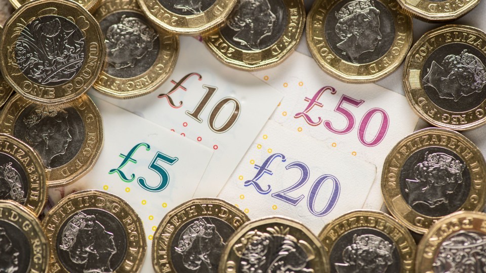 British five, ten, twenty, and fifty pound notes and one pound coins.