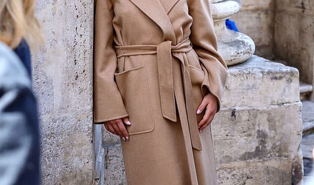 Florence Pugh, 30, looked effortlessly chic in a nude trench coat as she posed up a storm in a Max Mara photoshoot in Rome on Thursday