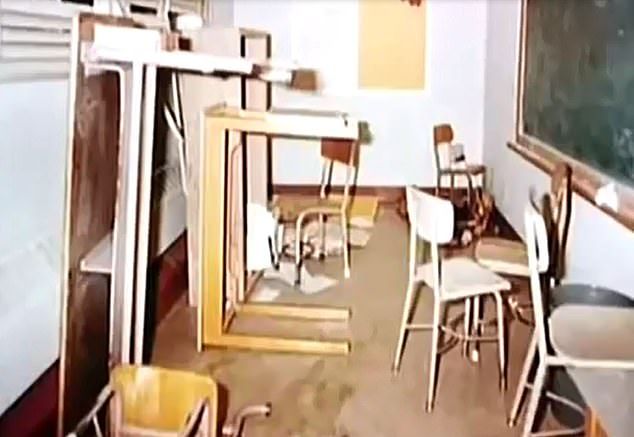 Some pupils made it upstairs into a classroom but many were stranded in the open or stood and watched and waited to be told what to do. Pictured: A classroom in the school in disarray following the shooting