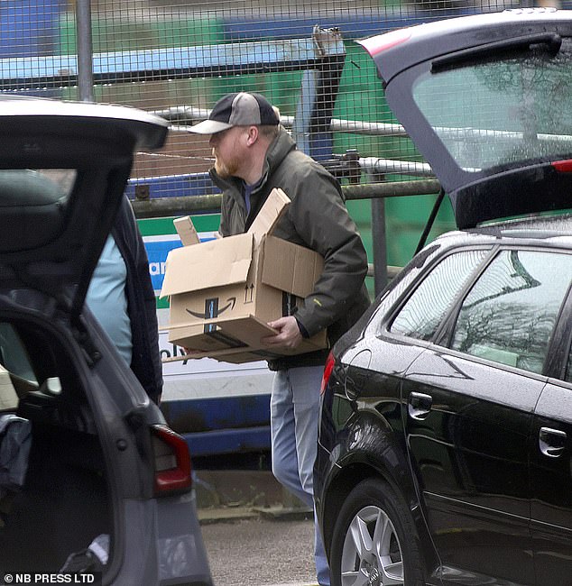 Wearing a baseball cap, jeans and jacket, Bush (pictured) loaded his black Audi full of bin liners, cardboard boxes and household goods before taking them to the dump in Otley, West Yorkshire