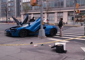 At least four vehicles, including a $200,000 McLaren, were seen wrecked following a botched heist just before 6am at a parking garage on West 43rd street in Hells Kitchen, Manhattan