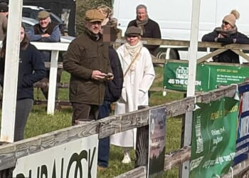 Geri Halliwell, dressed all in white, arrives at a point-to-point racing event at Edgcote with husband Christian Horner (to her left in brown cap)