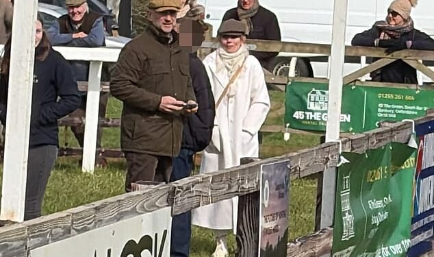 Geri Halliwell, dressed all in white, arrives at a point-to-point racing event at Edgcote with husband Christian Horner (to her left in brown cap)