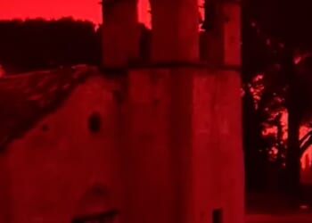 The Greek island of Crete has been cloaked in a choking Saharan dust storm as violent winds and a tornado battered the region, forcing Easter holiday flights from the UK to divert and turning the sky an eerie red-orange