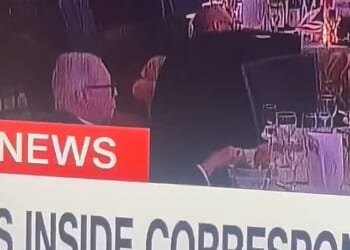 As others cowered under the tables at the White House Correspondents' Dinner, one man was seen calmly picking at his food