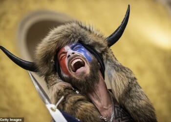 Jake Angeli, aka the 'QAnon Shaman,' inside the US Capitol on January 6, 2021. 'Everybody thinks I'm screaming... I was singing'