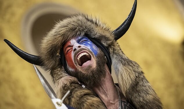 Jake Angeli, aka the 'QAnon Shaman,' inside the US Capitol on January 6, 2021. 'Everybody thinks I'm screaming... I was singing'