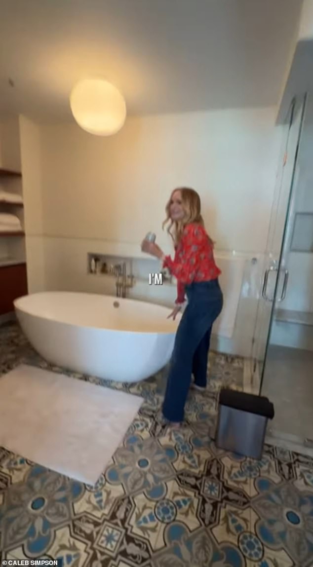 The bathroom contains a massive tub for Graham to unwind in