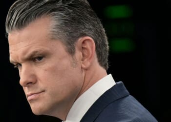 U.S. Secretary of War Pete Hegseth looks on during a news briefing at the Pentagon in Washington, DC on March 31, 2026.