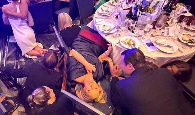 Several gunshots rang out as panicked attendees immediately ducked under their tables to protect themselves. A few journalists stayed seated or knelt, filming the chaos