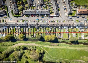 The area below the red line shows the sections of the gardens at the centre of the dispute