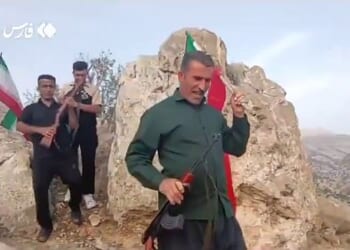 Tehran placed a bounty of £50,000 on the head of the American weapons systems operator who ejected from his F-15E Strike Eagle on Friday before the jet was 'obliterated' by a missile. Pictured: Armed Iranian tribesmen search for the missing US airman