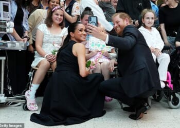The Duke and Duchess of Sussex were feted for visiting a hospital in Melbourne, posing with young patients yesterday