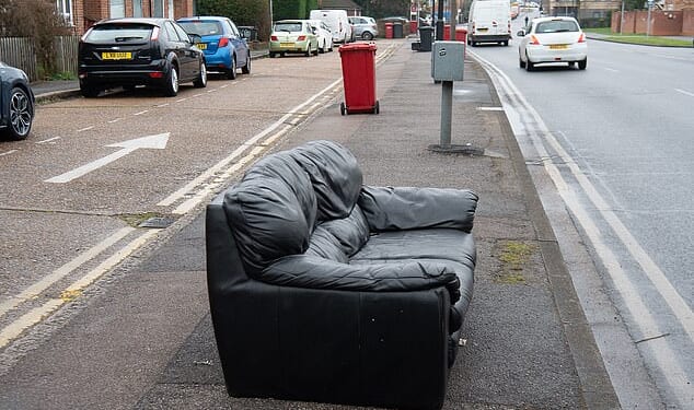 Fire safety rules that forced British sofas to be packed with potentially harmful chemicals are finally being overhauled after a years-long campaign by a mother who warned they posed a risk to families. Pictured: A sofa dumped on a pavement in Chalvey