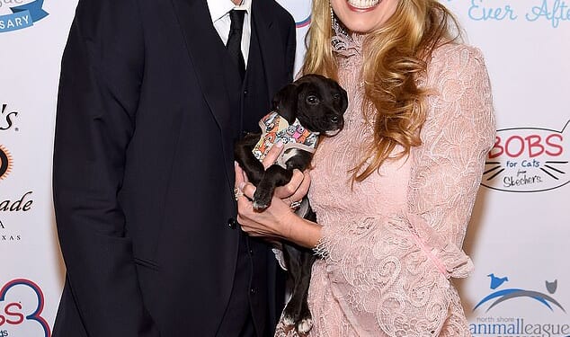 Howard Stern and his wife Beth Otrosky Stern are being sued by their former employee who claims the couple fostered a hostile work environment and used a false non-disclosure agreement to 'silence' her - the couple are pictured in 2019