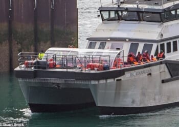 The Border Force catamaran Courageous brings migrants into the Port of Dover on Saturday, which saw a total of 602 arrivals