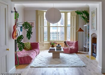 The living room is a sanctuary for Lisa and Buddy (the dog, pictured) and was previously used by a MasterChef winner to host supperclubs. The Togo sofa and chair are from Ligne Roset and have been with Lisa for eight years. The coffee table is an Ebay find and the rug is La Redoute. The flooring is by Parador.