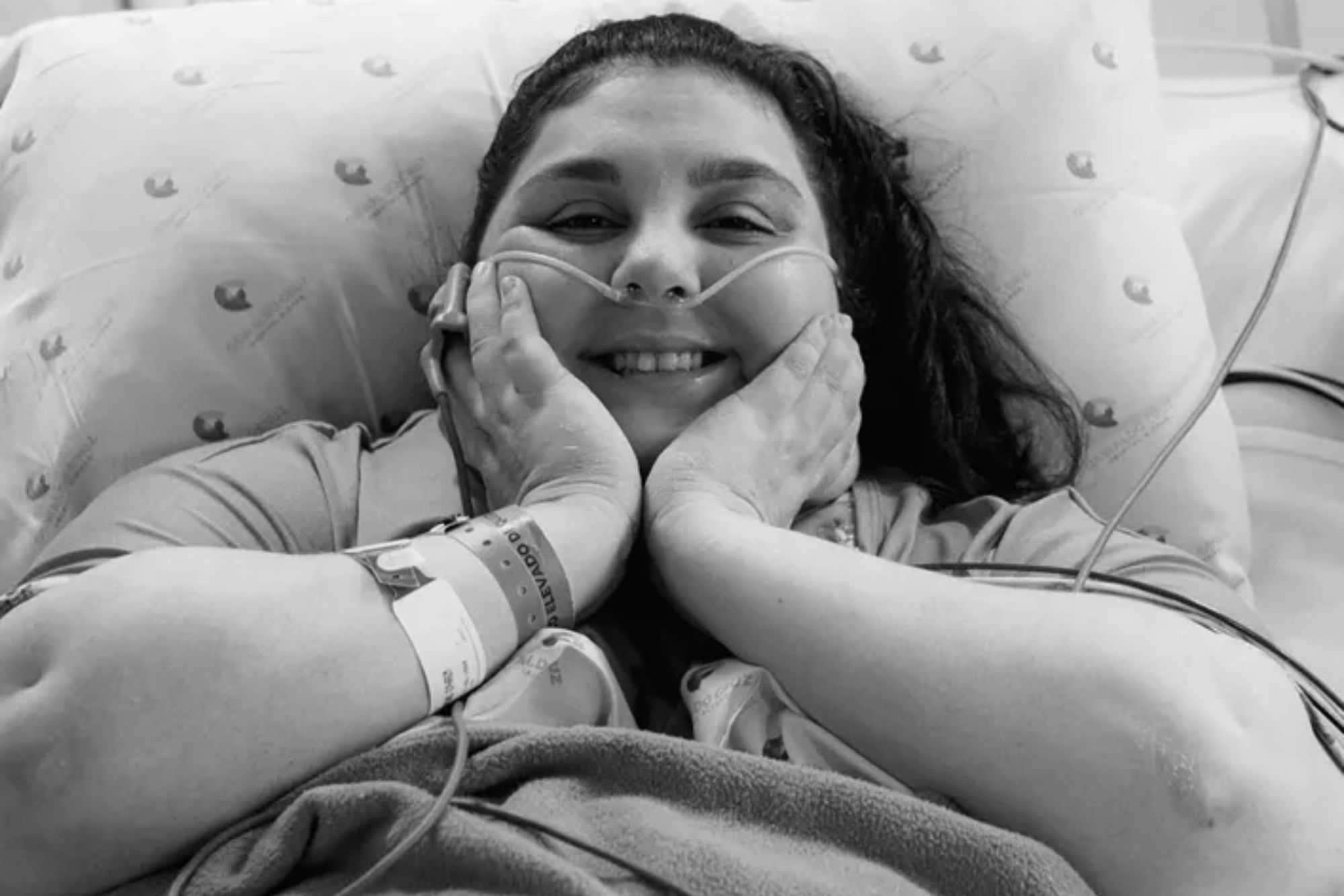 An image collage containing 1 images, Image 1 shows A person with a nasal cannula and hospital bracelet smiles at the camera