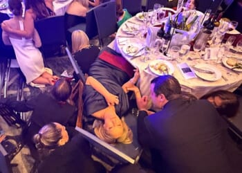 Several gunshots rang out as panicked attendees immediately ducked under their tables to protect themselves