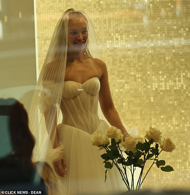 She also slipped into a second dress and equally as stunning in the corseted gown which featured a semi-sheer bodice