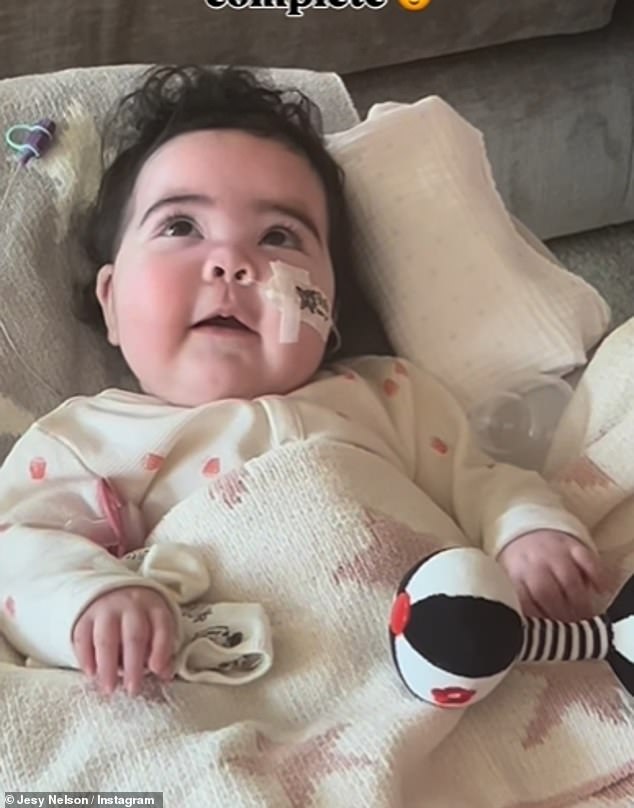 In her new post, she captured twin Story lying down under a blanket while surrounded by cushion toys