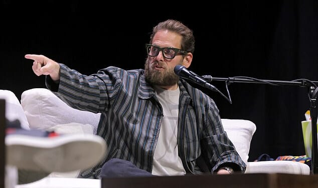 Jonah Hill, 42, spoke about his experiences working with 'f***ing nuts' director David O. Russell when he was 21 and making his debut in I Heart Huckabees during a live taping of the Smartless podcast on Saturday in LA (pictured)