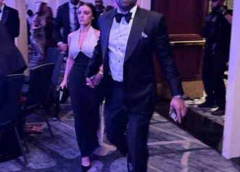 FBI Director Kash Patel and his girlfriend, Alexis Wilkins, leave the White House Correspondents' Dinner after a shooter opened fire