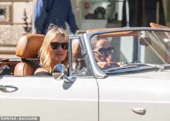Kate Moss was spotted driving around London in a white MG convertible last week