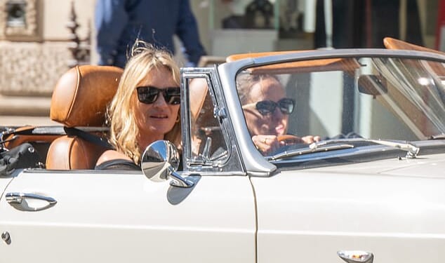 Kate Moss was spotted driving around London in a white MG convertible last week