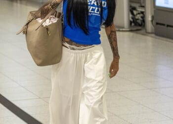 Katie Price looked delighted as she headed to Dubai to reunite with her husband, Lee Andrews , on Saturday evening