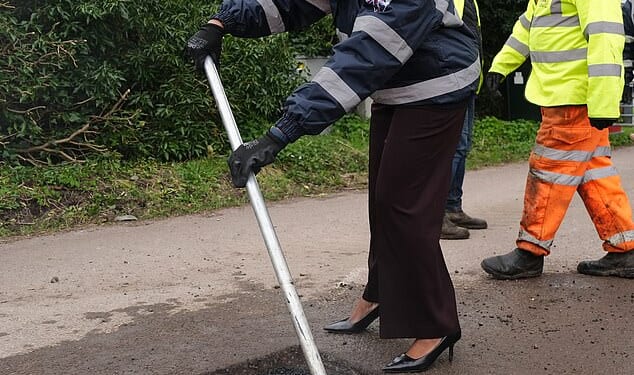 The Conservative opposition leader was pictured smoothing out the roads today in the West Midlands as part of her campaign trail for the local elections